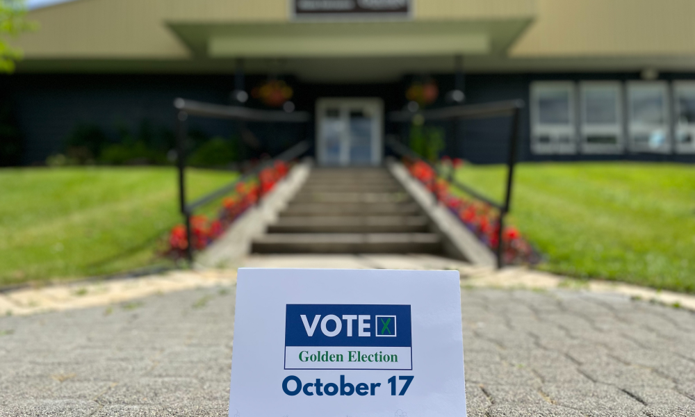 Vote October 17 sign in front of Town Hall