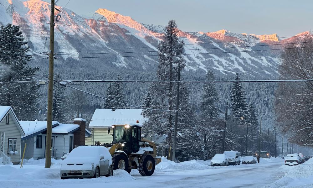 loader moving snow in golden