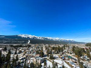 The Town of Golden in the spring with blue skies and mountains in the background.